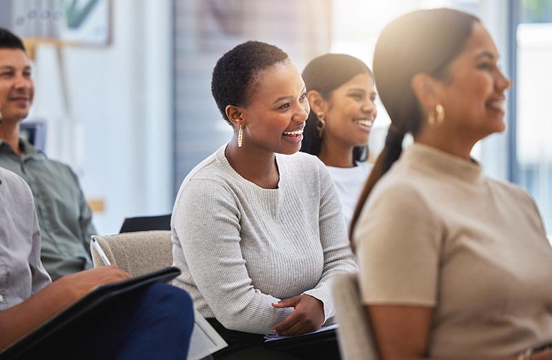 Employees collaborating in a skills workshop, building capabilities together for growth.